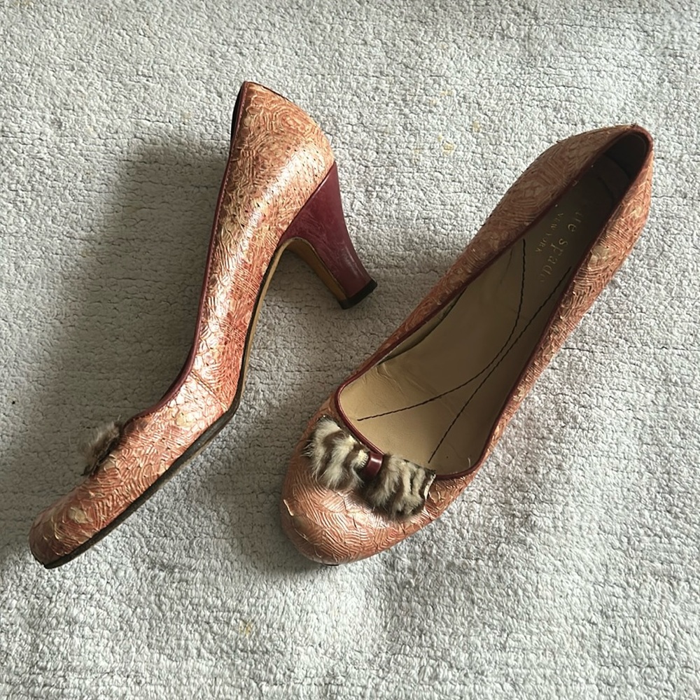Kate Spade blush-colored snakeskin pumps with fur bow.